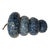 A striking vintage ceramic wind bell featuring four graduated, ribbed pottery forms suspended together on a rustic...