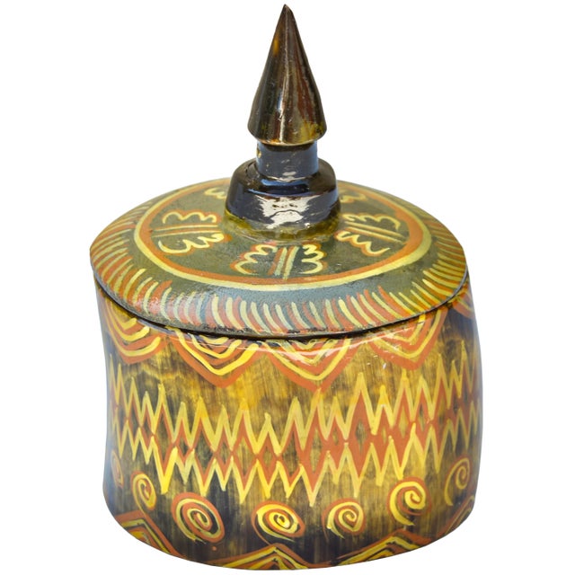 Beautiful vintage West-African lidded bowl, thoughtfully handmade in an ornate silhouette with natural horn hues....