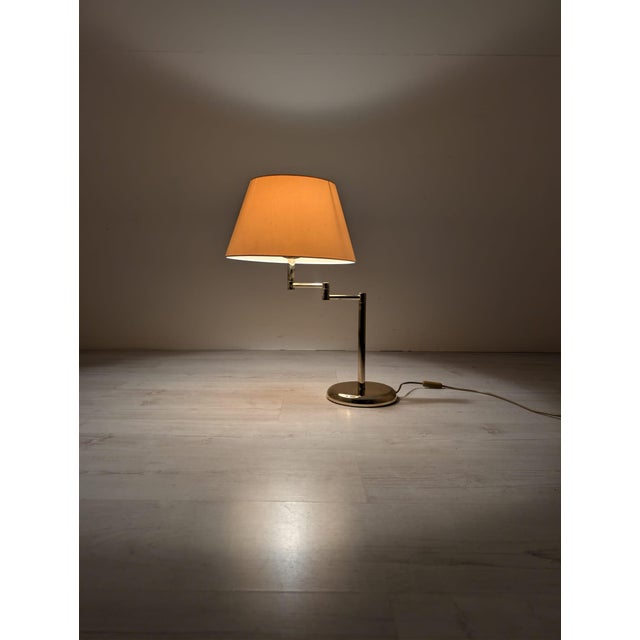 Hollywood Regency Brass Table Lamp Stylish Hollywood Regency brass table lamp. The lamp's height and tilt are adjustable,...