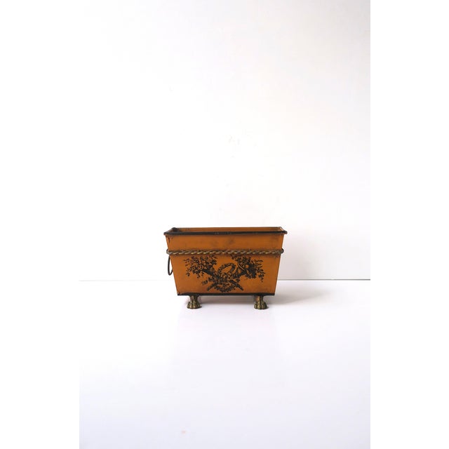 An Italian hand‑painted tole cachepot with lion paw feet, in the Neoclassical/Empire design styles, signed Italy, circa...