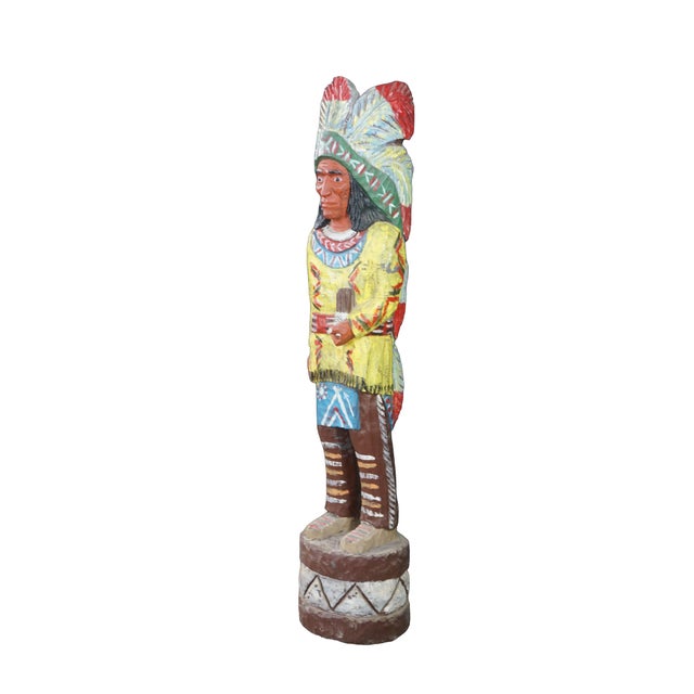 This 60-inch vintage hand-carved solid wood cigar store Indian statue by renowned woodcarver Ralph Gallagher is an...