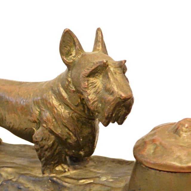 An exceptional find for the antique desk accessory collector or Scottish Terrier enthusiast, this authentic 1920s cast art...