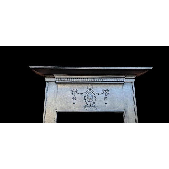 An elegant original edwardian cast iron fireplace surround dating precisely to 1907, reclaimed from a period property in...