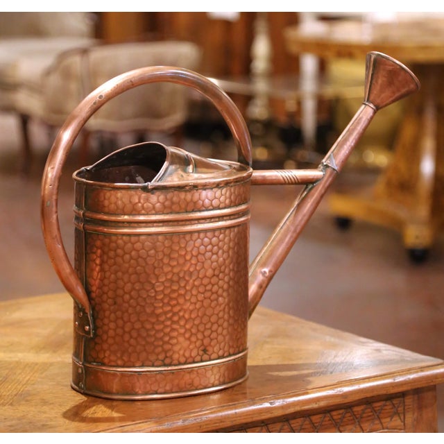 Originating from Normandy, France, this 19th-century watering can is a fine example of provincial craftsmanship. The...