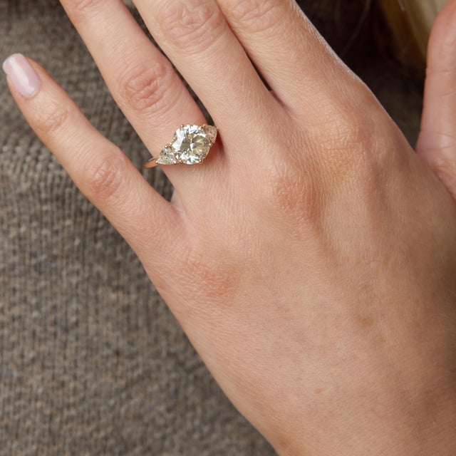 A bold and unforgettable vintage engagement ring, this striking design centers on a magnificent 3.71 carat round brilliant...