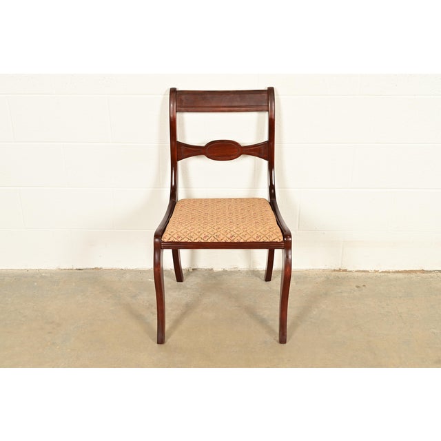 A gorgeous Regency style side chair or dining chair In the manner of Kindel Furniture USA, Circa 1940s Carved mahogany...