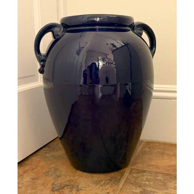Blue Glazed Twin-Handled Vessel Dimensions: 16” H × 12” W Material: High-gloss ceramic Color: Deep cobalt blue with...