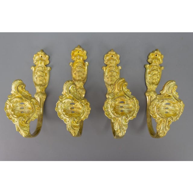 Antique French Rococo style gilt bronze curtain tiebacks or curtain holders, set of four. A beautiful and impressive set...