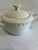 A vintage covered sugar bowl by Wedgwood & Co. Ltd. in the Hedge Rose pattern. Made in England and dated 7-65, the creamy...
