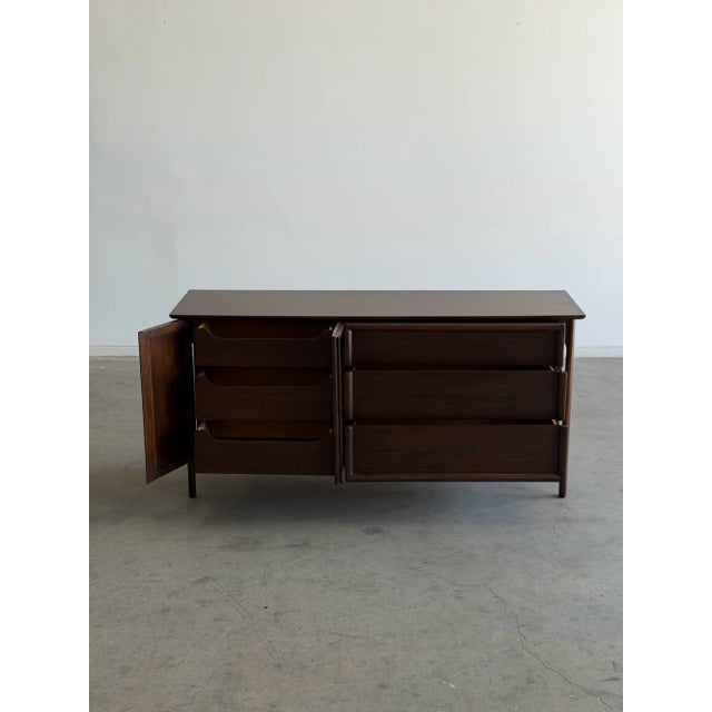 W64 D19 H31.5 This item has been fully restored structurally and aesthetically. Structurally the drawers have new ball...