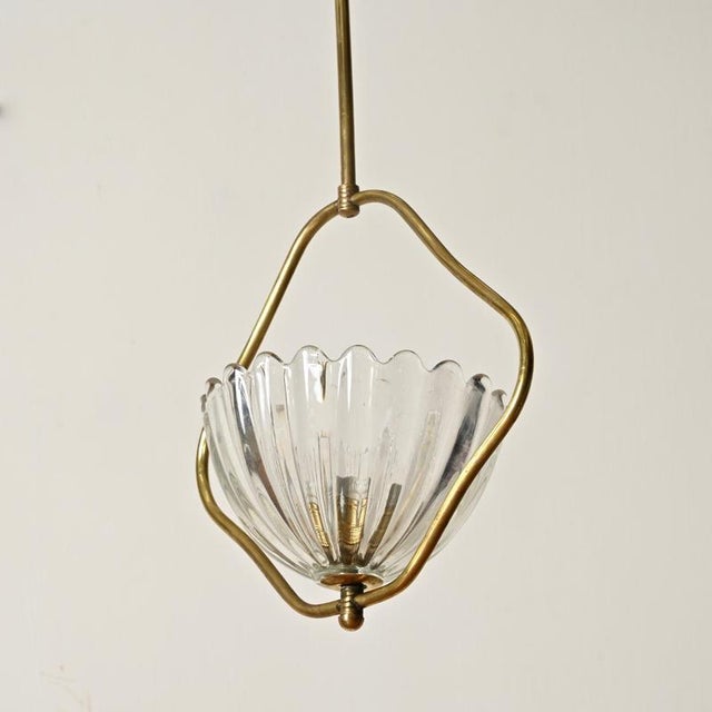 Delightful flower-shaped chandelier in murano mouth-blown glass and brass. This wonderful and unique piece was produced by...