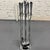 Chrome Art Deco Style 4-piece fireplace tool set from the 70s which icludes a poker, a shovel, a brush, tongs all held...