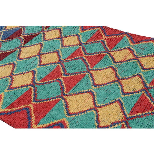 Hand-knotted in wool and originating from Morocco circa 1950-1960, this 5x7 vintage Moroccan rug is an extremely rare...