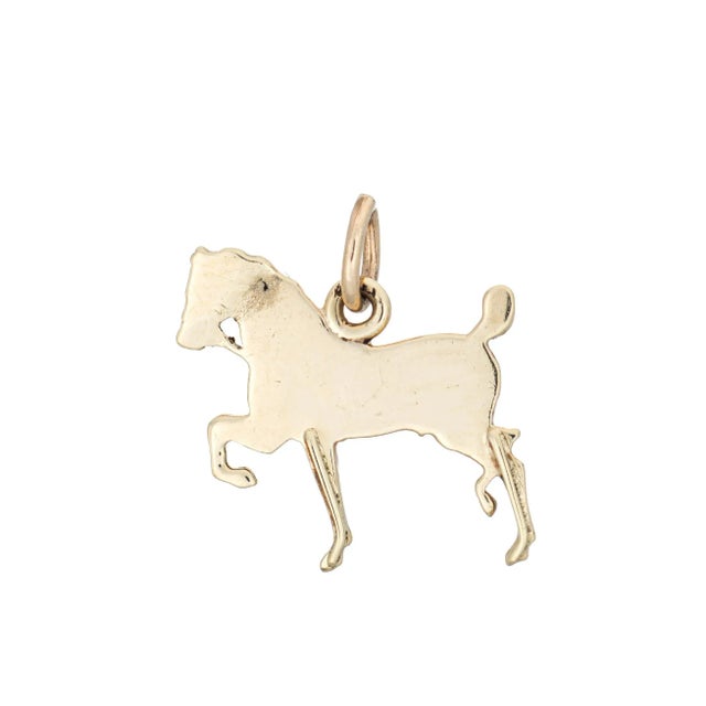 Finely detailed antique Victorian horse charm (circa 1880s to 1900s), crafted in 14 karat yellow gold. Small seed pearls...