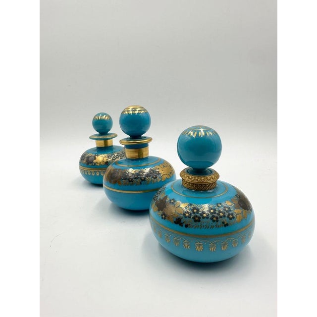 Turquoise Blue Opaline Bottles with Painted Golden Flowers Decoration, 1890s, Set of 3, in Flawless conditions. Designed...