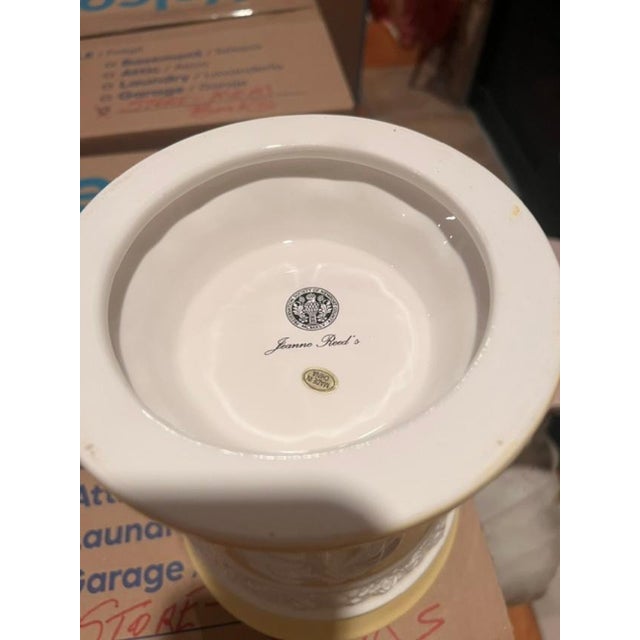 This is a decorative ceramic pot featuring the official insignia of the Preservation Society of Newport County and the...