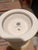 This is a decorative ceramic pot featuring the official insignia of the Preservation Society of Newport County and the...