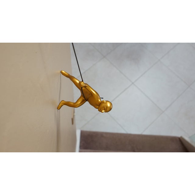 Contemporary Gold Climbing Man Wall Art- Position 1 For Sale - Image 3 of 4