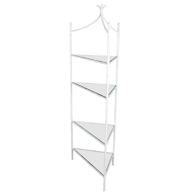 A vintage faux bamboo corner etagere with five mirrored shelves. The painted white metal etagere with bamboo form ends in...