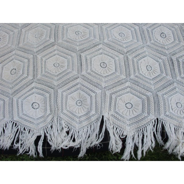 A hand crocheted bedspread with exceptional detail.