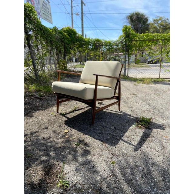 Absolutely stunning lounge arm chair by Kofod Larsen for Selig. An elegant and sleek silhouette that is unmistakably Mid...