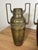 A set of two vintage brass vases or amphorae, in the Art Nouveau or Art Deco style, dating from the early 20th century....