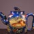 This striking vintage teapot is crafted from Yixing zisha (purple clay), a traditional material prized for tea brewing....
