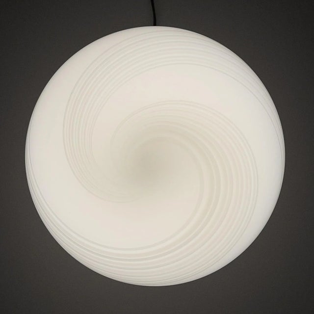 Classic white murano table lamp made in italy in the 1970s. Very beautiful white glass with bends in the form of a sphere....