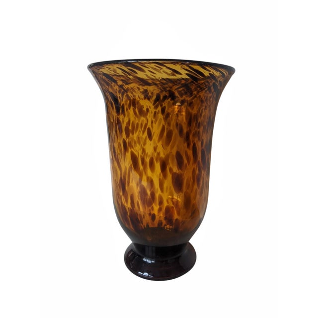 This hand-blown tortoiseshell art glass vase adds rich texture and visual warmth to any space. The flared rim and heavy,...