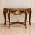 This sophisticated French Louis XV-style console table features a beautifully crafted wood frame with a luxurious marble...