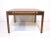 A nice sized square medium dark walnut coffee table with floating styled top design in a very well crafted manner . An...