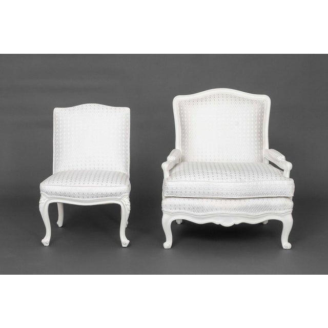 Two Louis XV Style White Painted Wood Chairs, comprising: one fauteuil and one side chair, in matching diamond pattern...