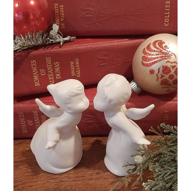 A charming pair of all-white bisque kissing angels, a delightful vintage find straight out of the 1950s-60s! These...