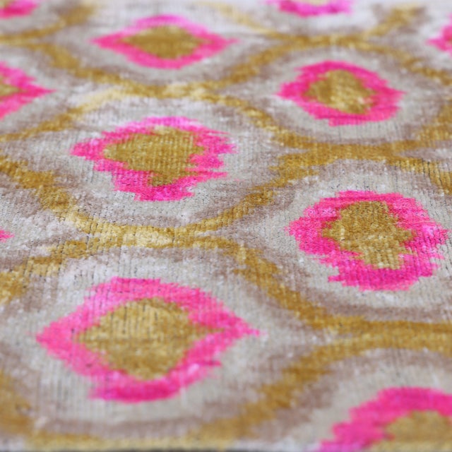 "Playful yet undeniably sophisticated, this handmade silk velvet pillow celebrates bold color through the lens of timeless...