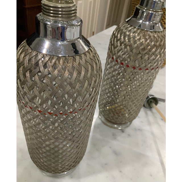 Sparklets Ltd. London, English Seltzer Bottles / Soda Siphons With Original Straws, Red Fill Bands & Woven Metal Mesh - Mid-20th Century Pair For Sale - Image 11 of 12