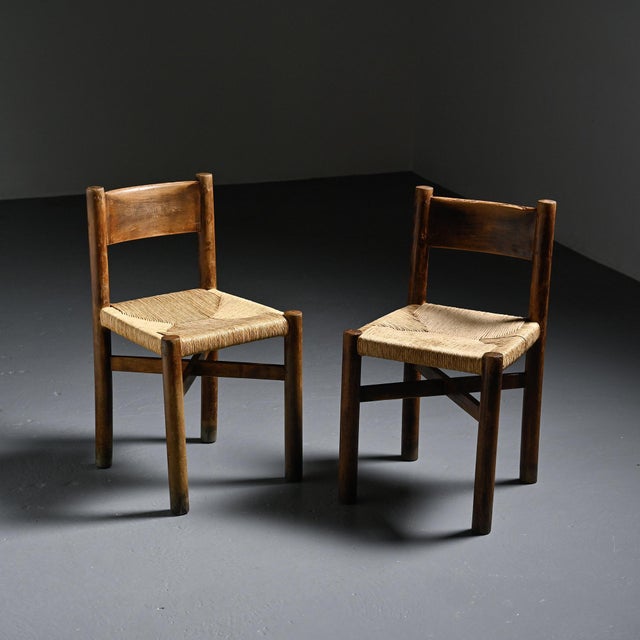 Pair of Méribel chairs designed by Charlotte Perriand in the 1940s for the Méribel ski resort in the French Alps. The ash...