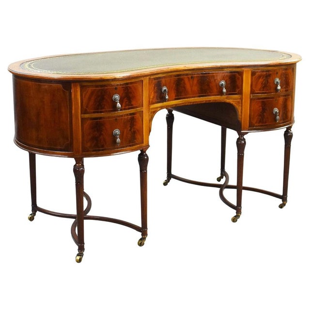 Edwardian Flame Mahogany Kidney-Shaped Writing Table Item Code: 1386 A striking early 20th-century Edwardian kidney-shaped...