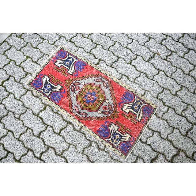 This is a vintage Turkish Oushak rug from the 1960s. The piece was hand-knotted.