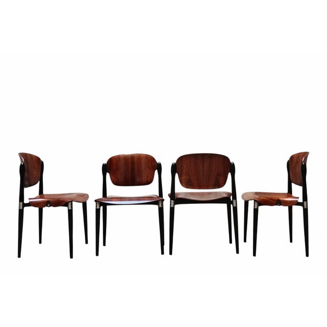 A stunning and elegant set of four S83 chairs, designed by the renowned architect and designer Eugenio Gerli for Tecno in...