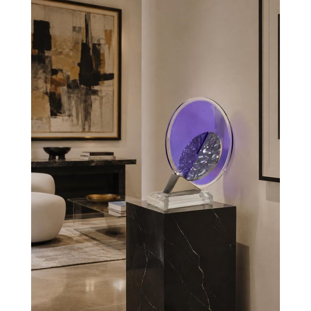 Striking 1994 postmodern abstract table sculpture featuring a bold geometric composition of clear and purple Lucite...