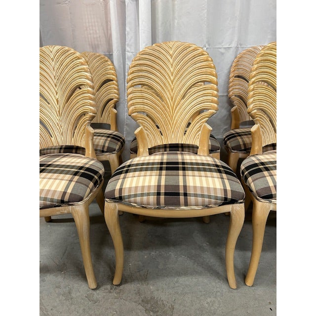 Chic set of 8 wood carved palm frond leaf chairs for your dining room table.