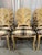 Chic set of 8 wood carved palm frond leaf chairs for your dining room table.