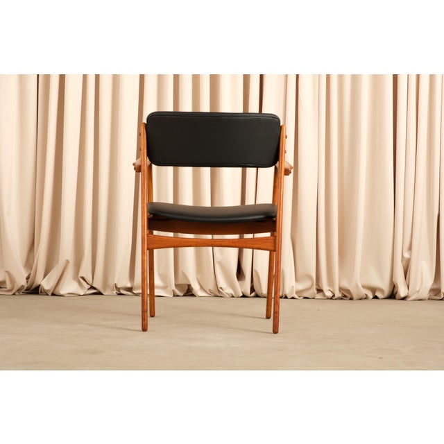 These are the chairs Erik Buch is best known for, the ones where the seat and backrest appear to float free of the frame,...