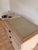 This is a three drawer nightstand from Ficks Reed. Good condition Glass top.