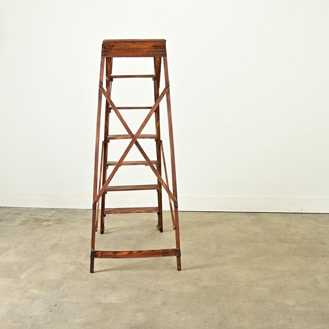 Dimensions: 58 ¼” H x 23 ⅛” W x 41” D French 20th century oak folding ladder or library stairs. The design of the ladder...
