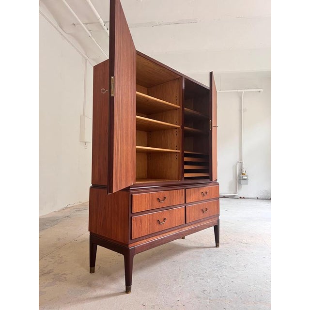 This teak office cabinet is a Danish original from the 1950s. with its well-thought-out layout, it's the perfect practical...