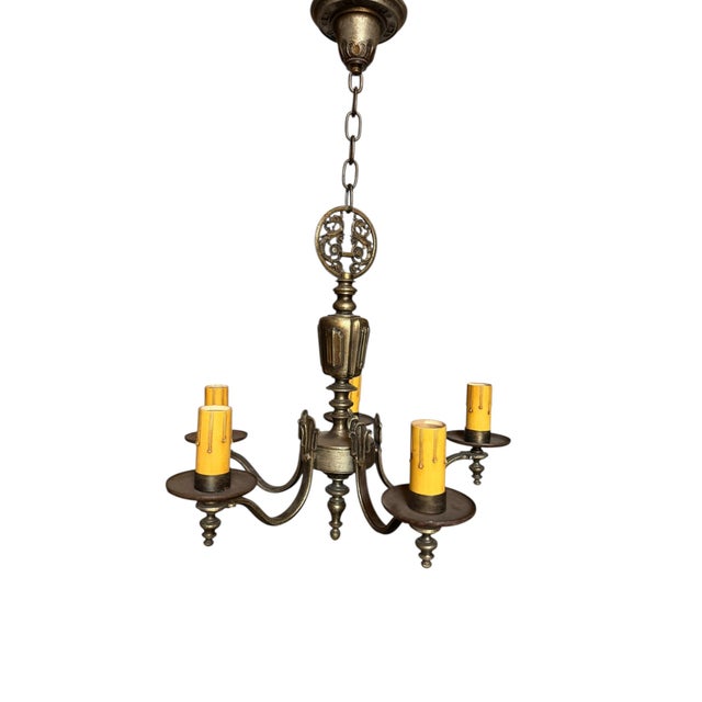 This fabulous chandelier will look amazing over a dining room table, in a bedroom or living room. The aged patina looks...