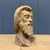 Carved wooden head of a bearded man. In the past, this served as a preliminary piece or test for a larger sculpture or...