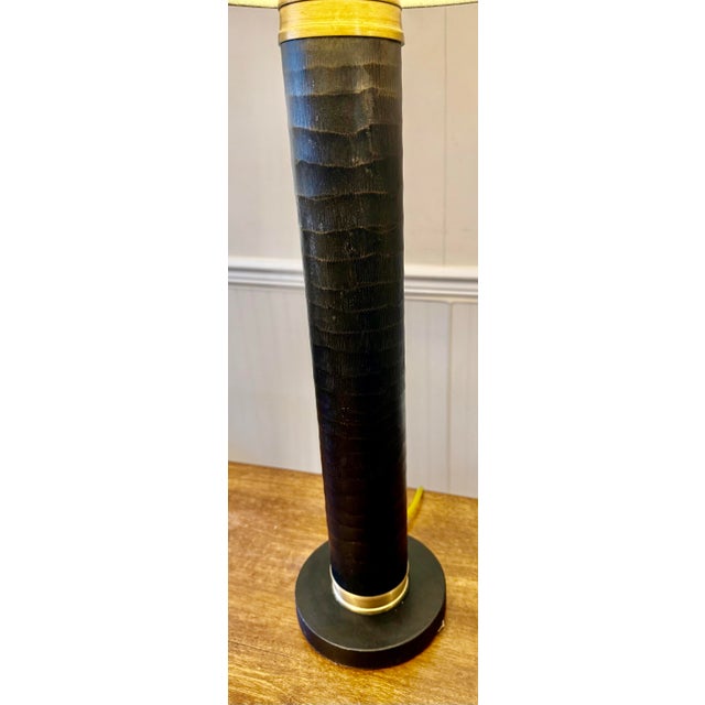 The Bokeh Table Lamp by Currey and Company in tan, black finish offers a sophisticated look featuring a slim cylindrical...