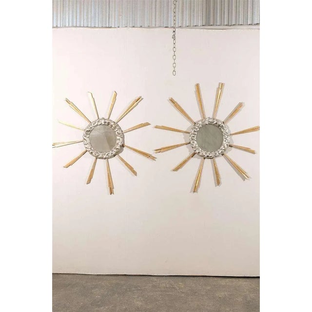An Italian mid-19th century gilded cloudy sunburst mirror with new glass. Delicate sun rays. We have a pair available,...